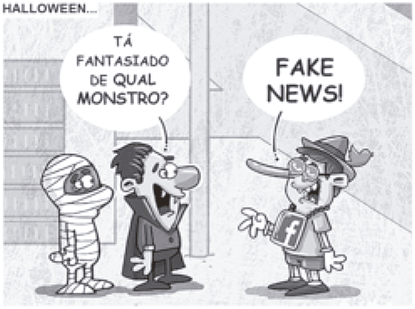 Cartum em preto e branco com o título 'HALLOWEEN...'. Mostra três personagens. O primeiro está fantasiado de múmia. O segundo, fantasiado de vampiro, pergunta a um terceiro personagem: 'TÁ FANTASIADO DE QUAL MONSTRO?'. O terceiro personagem usa um chapéu, tem um nariz muito comprido (como o do Pinóquio, símbolo da mentira) e veste uma camiseta com o logotipo do Facebook (a letra 'f'). Ele responde alegremente apontando para si mesmo: 'FAKE NEWS!'.