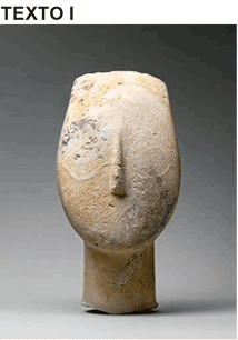 Escultura antiga Cabeça de uma figura feminina (2700-2500 a.C.) exibindo um rosto oval simplificado, sem olhos ou boca detalhados, apenas com um nariz alongado em relevo.